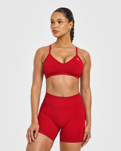 EnhanceLift™ Seamless Strappy Sports Bra with White Logo | Light Toasted Red