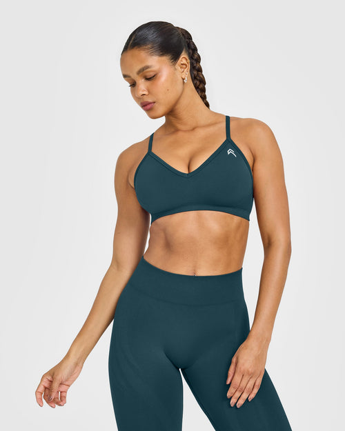 Oner Modal EnhanceLift™ Seamless Strappy Sports Bra with White Logo | Washed Oil Blue