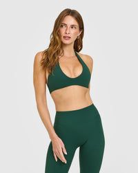 SoftMotion™ Minimal Halter Neck Bralette with White Logo | Dark Racing Green