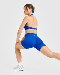 SoftMotion™ Minimal Halter Neck Bralette with White Logo | Light Cobalt Blue